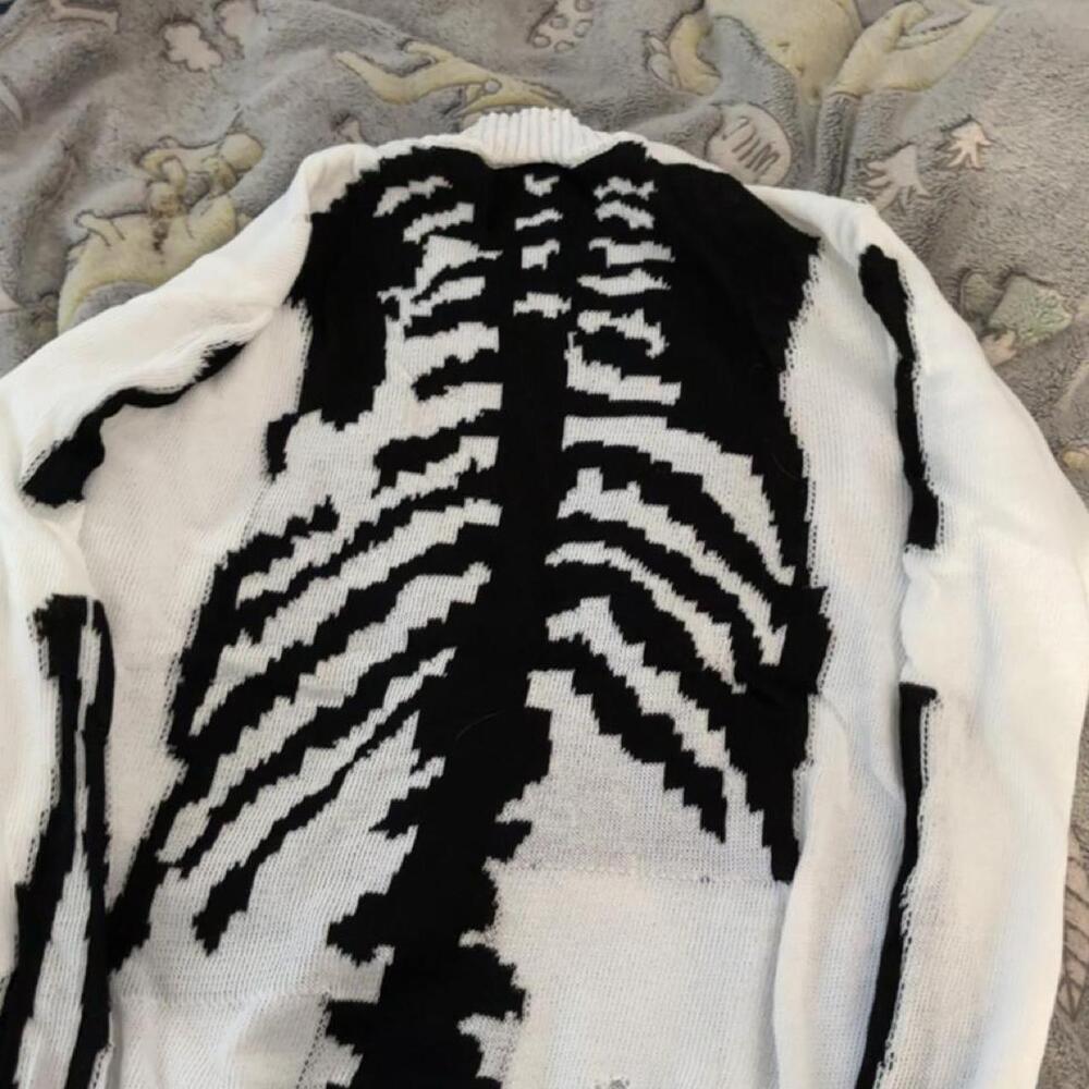 White & black skeleton sweater with black ribcage graphic
